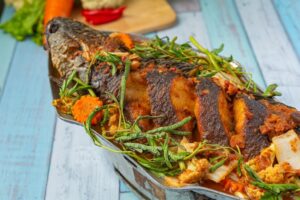 sour-curry-with-snakehead-fish-spicy-garden-hot-pot-thai-food_1150-26407